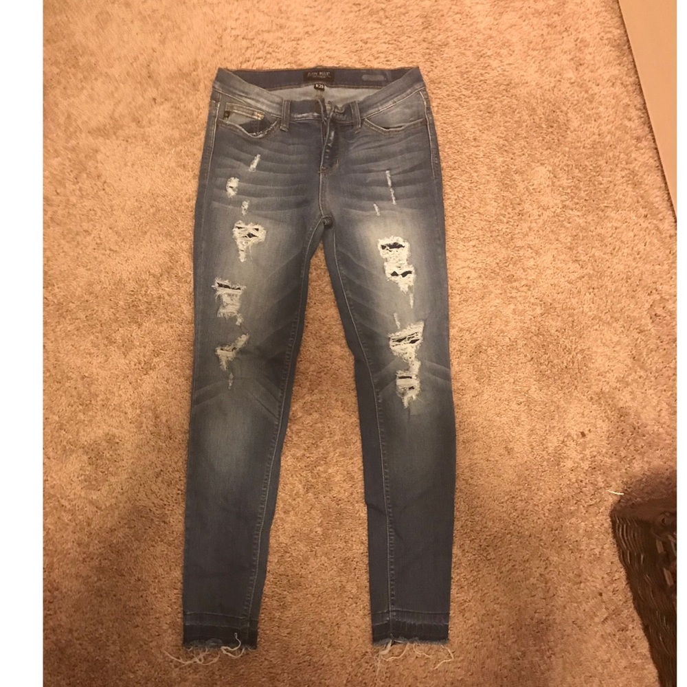 Distressed jeans.